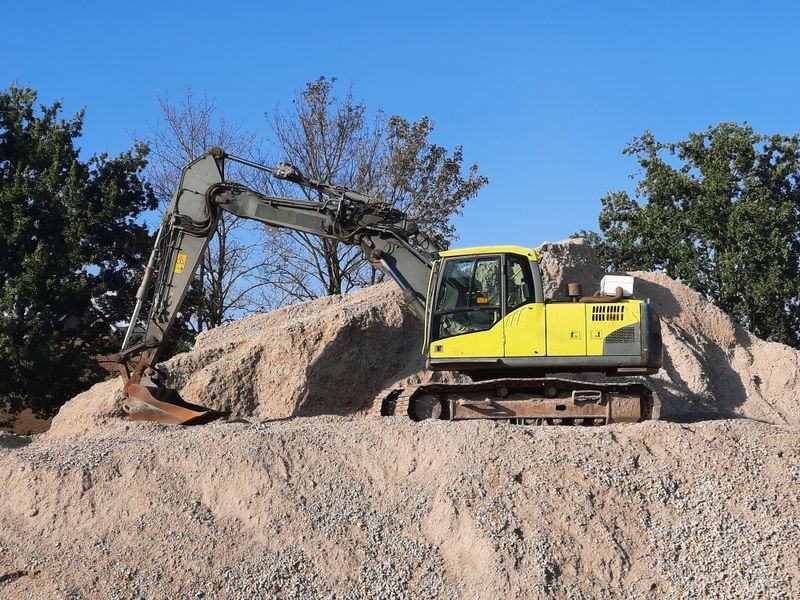 Land clearing and stump removal on a wooded lot in South County, Rhode Island